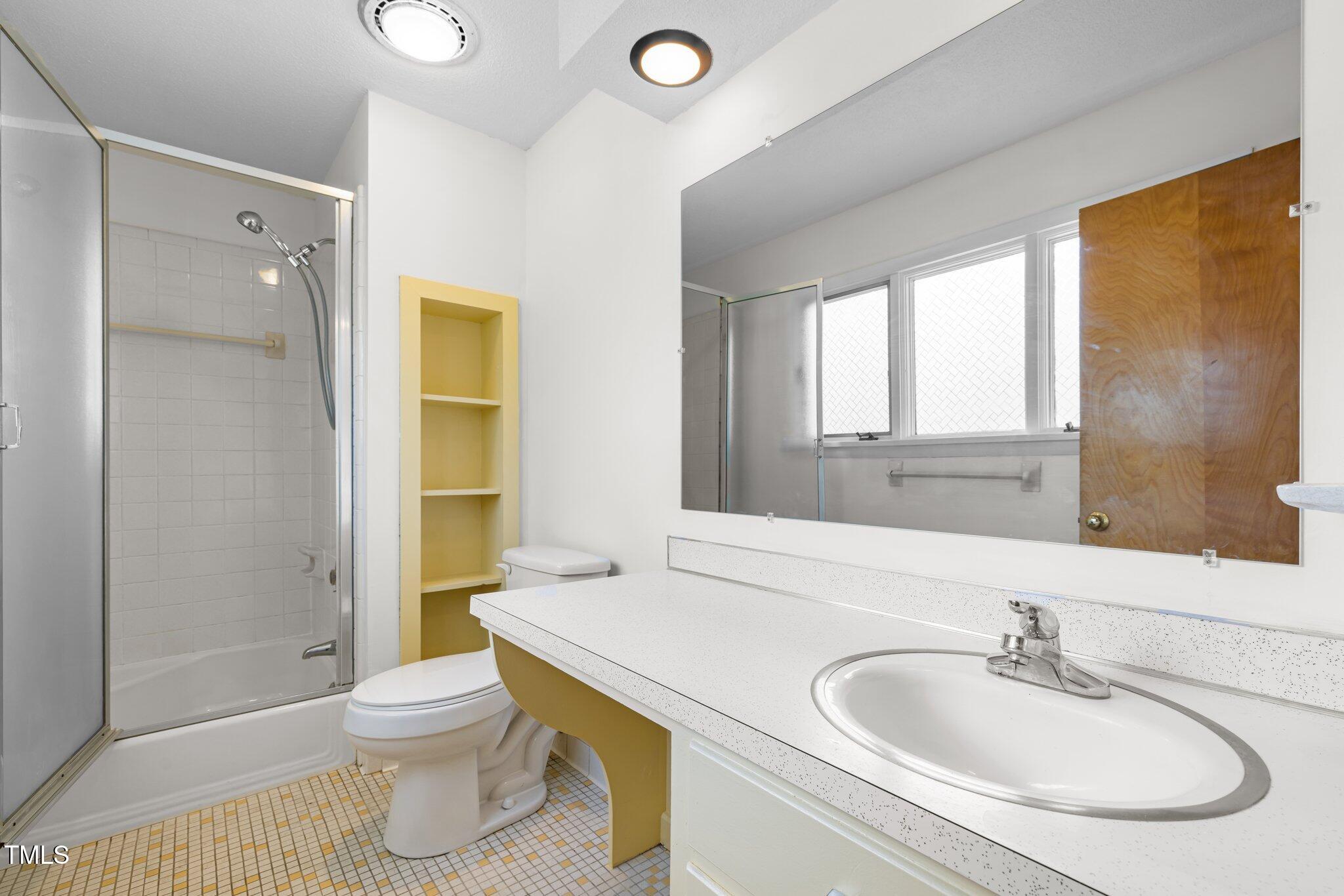 1024 Chalmers Street Durham, NC 27707 - Photo 28 of 41 a bathroom with a sink and a toilet