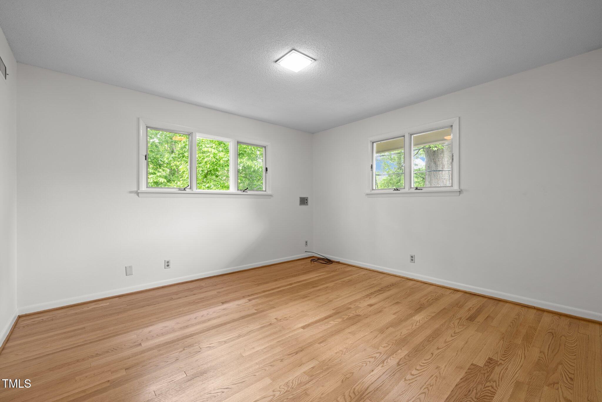 1024 Chalmers Street Durham, NC 27707 - Photo 29 of 41 an empty room with windows