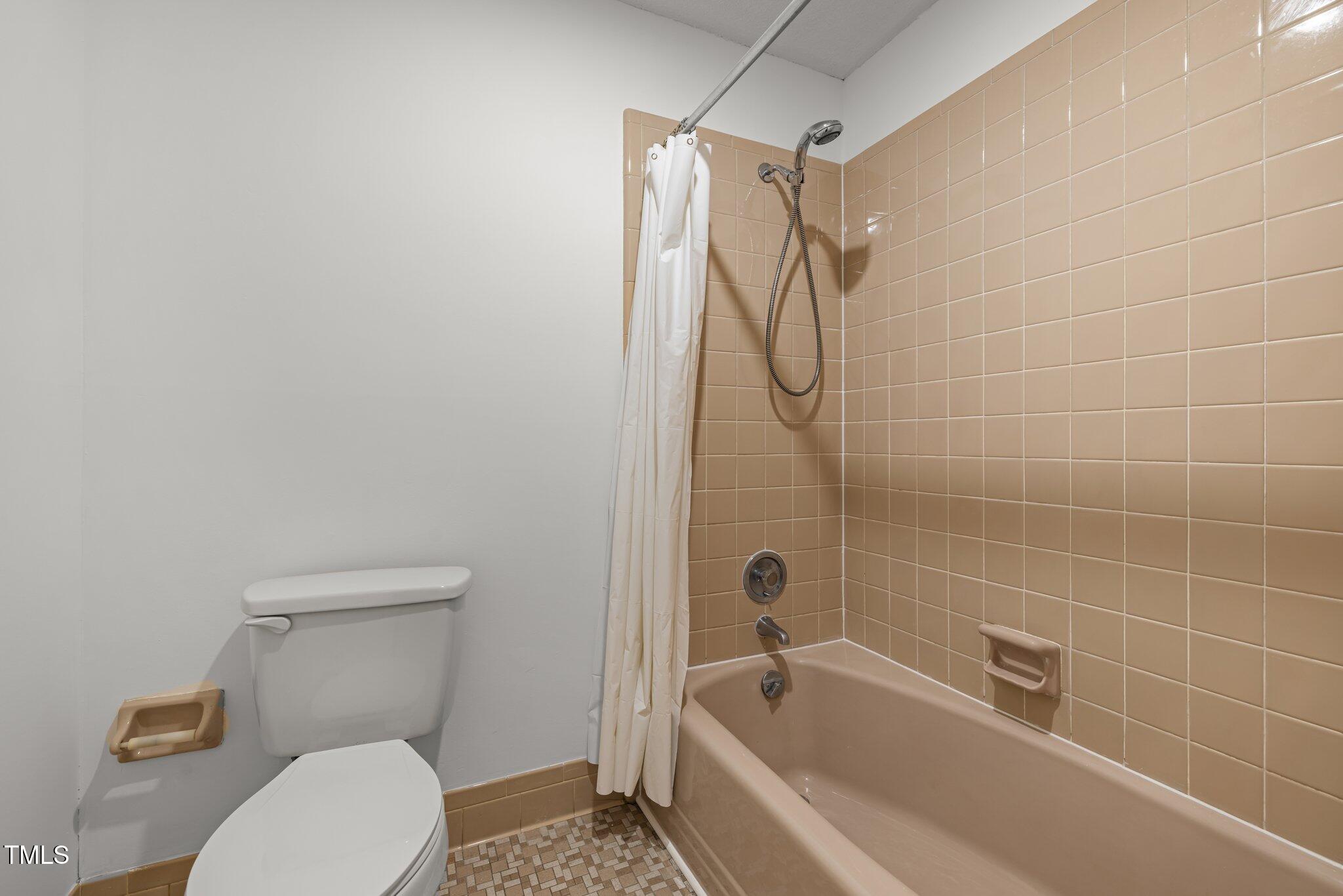 1024 Chalmers Street Durham, NC 27707 - Photo 33 of 41 a bathroom with a toilet and shower