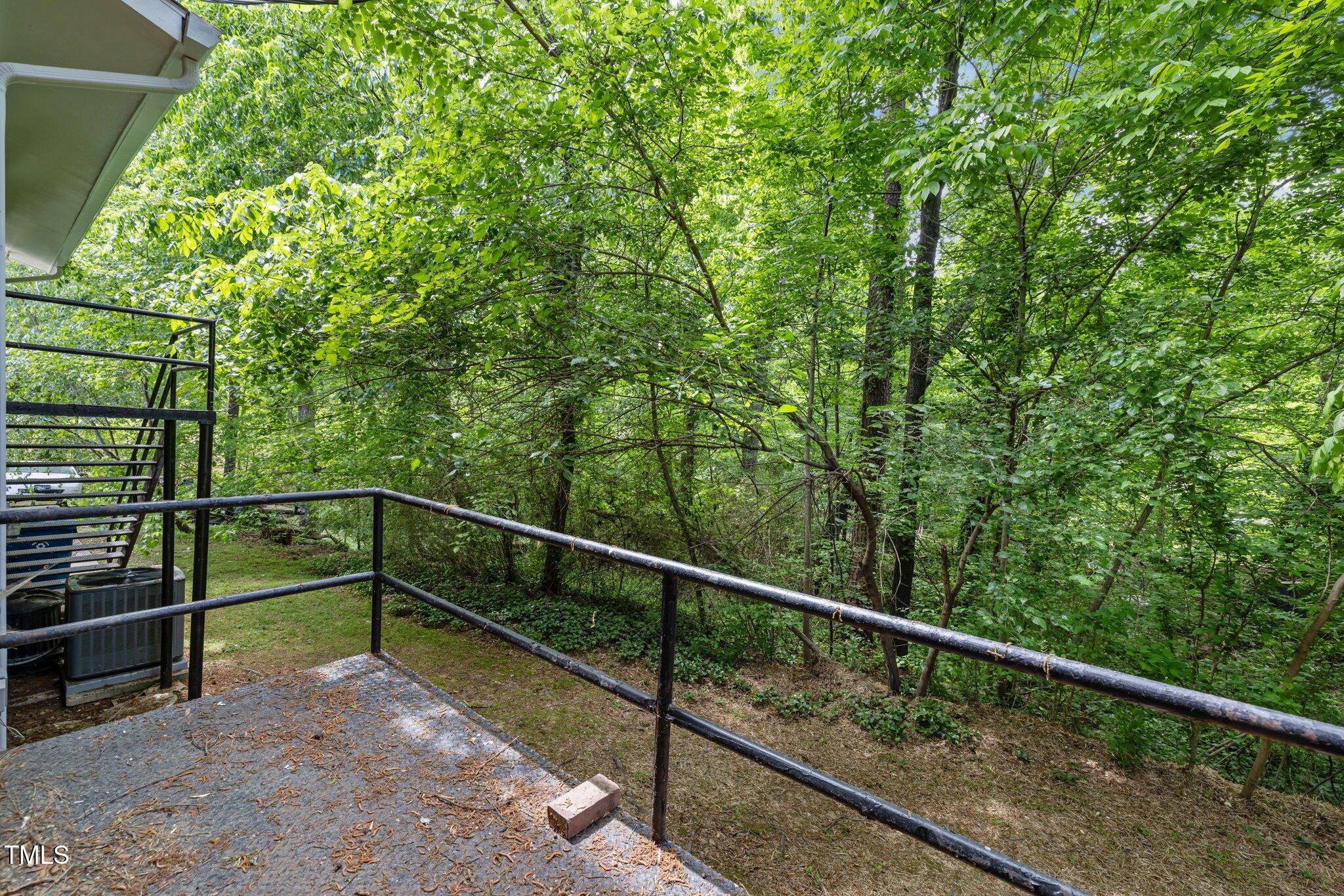 1024 Chalmers Street Durham, NC 27707 - Photo 37 of 41 a view of a balcony with trees