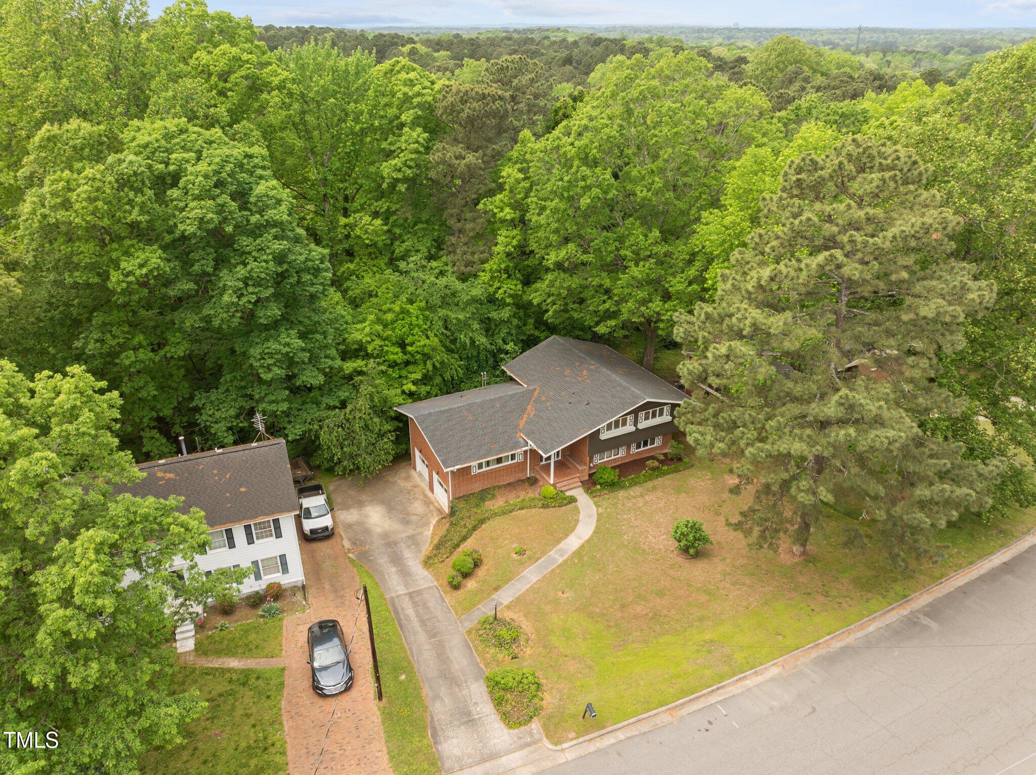 1024 Chalmers Street Durham, NC 27707 - Photo 40 of 41 an aerial view of residential house with outdoor space and trees around