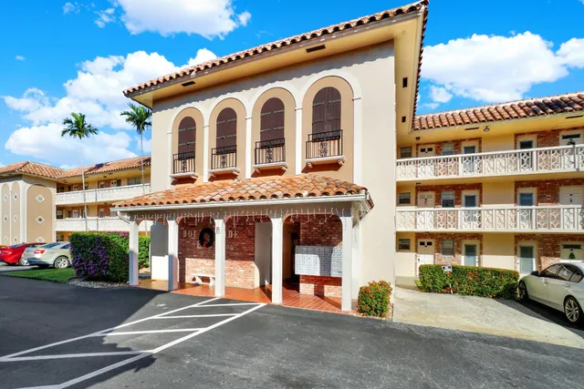 a front view of a building with lots of yellow lighting