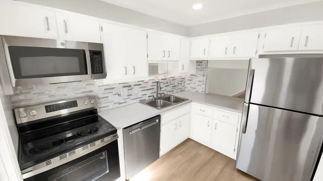 a bedroom with furniture and a flat screen tv