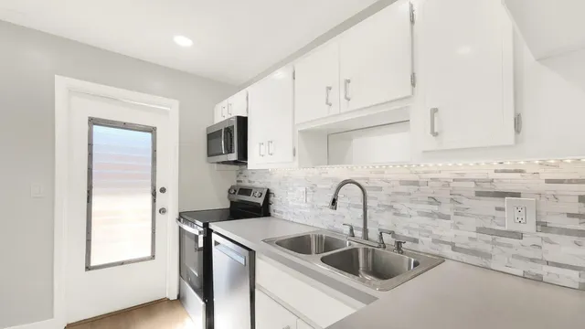 a bedroom with a bed and a potted plant