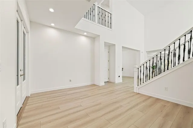 a view of an entryway with wooden floor