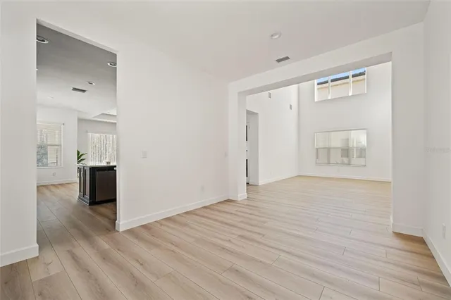 a kitchen with stainless steel appliances kitchen island granite countertop a sink and cabinets