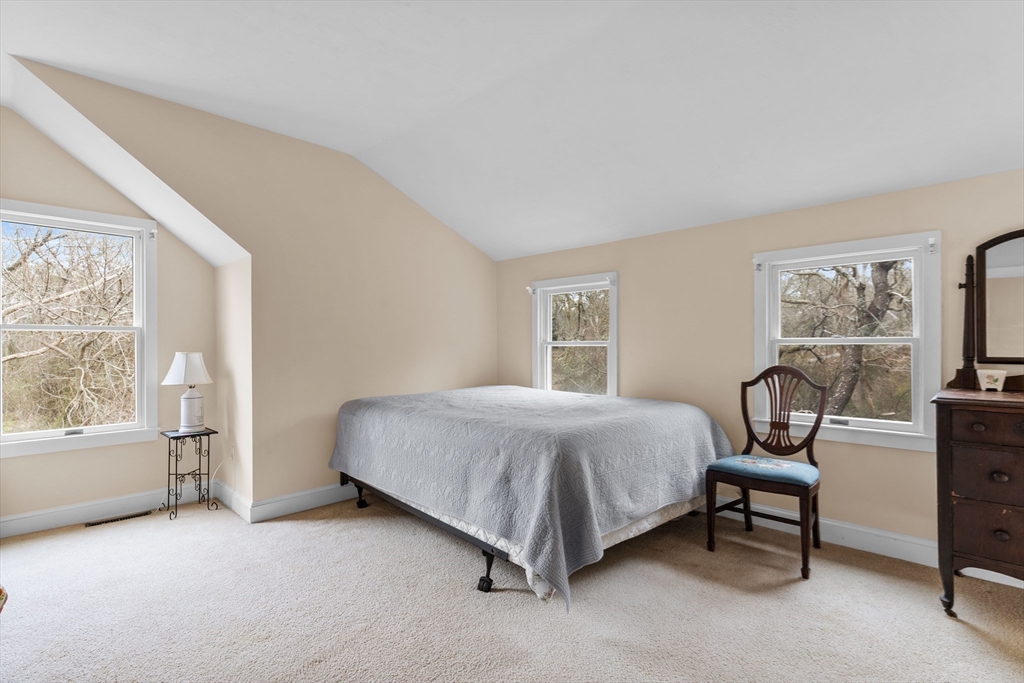 376 Pleasant Bay Road Harwich, MA 02645 - Photo 12 of 17 a bedroom with a bed chair and window