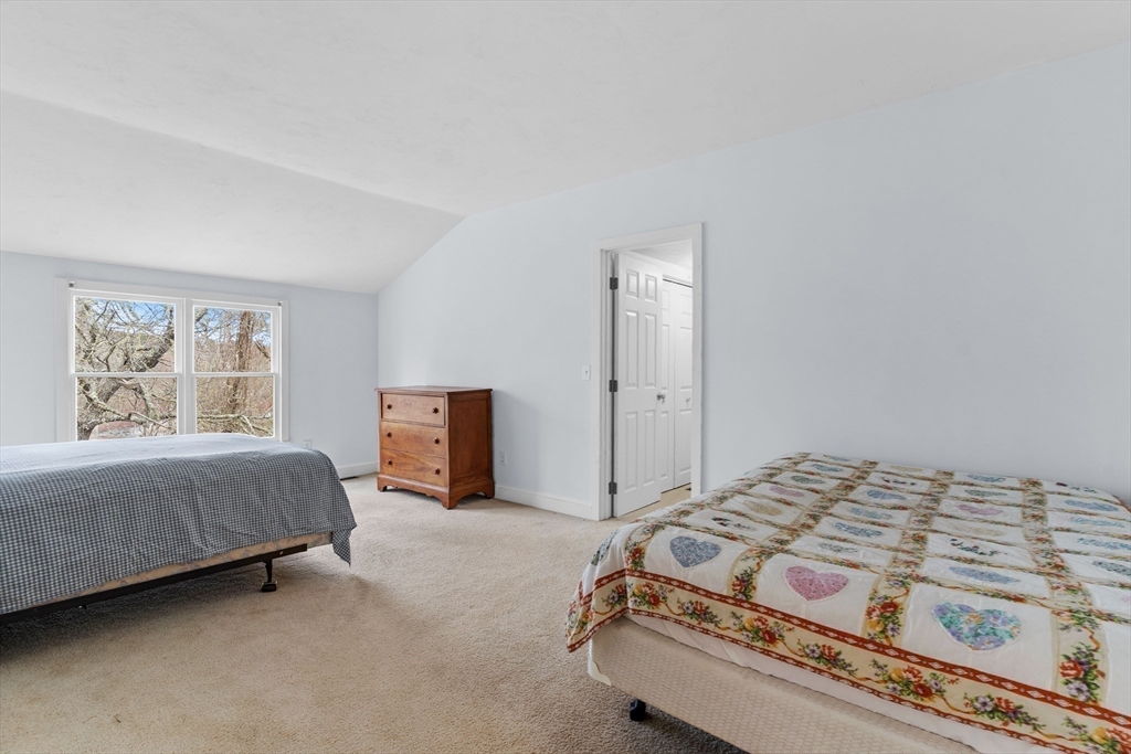 376 Pleasant Bay Road Harwich, MA 02645 - Photo 13 of 17 a bedroom with a bed and a window