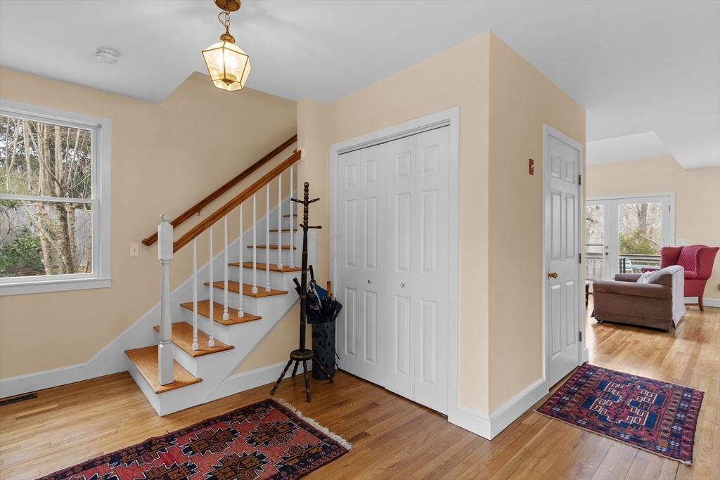 376 Pleasant Bay Road Harwich, MA 02645 - Photo 3 of 17 a view of an entryway with wooden floor and windows