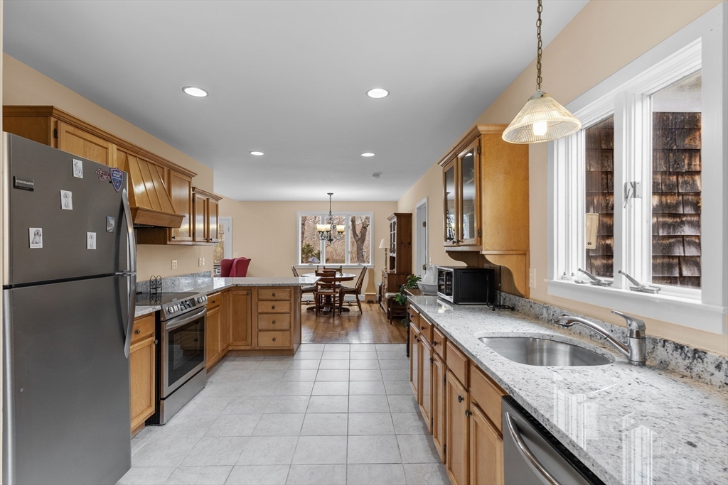 376 Pleasant Bay Road Harwich, MA 02645 - Photo 6 of 17 a kitchen with stainless steel appliances granite countertop a sink counter space cabinets and a stove