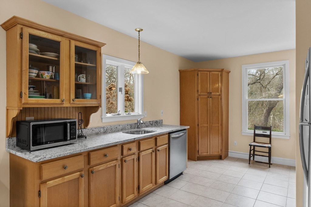 376 Pleasant Bay Road Harwich, MA 02645 - Photo 7 of 17 a kitchen with stainless steel appliances granite countertop a stove and a sink