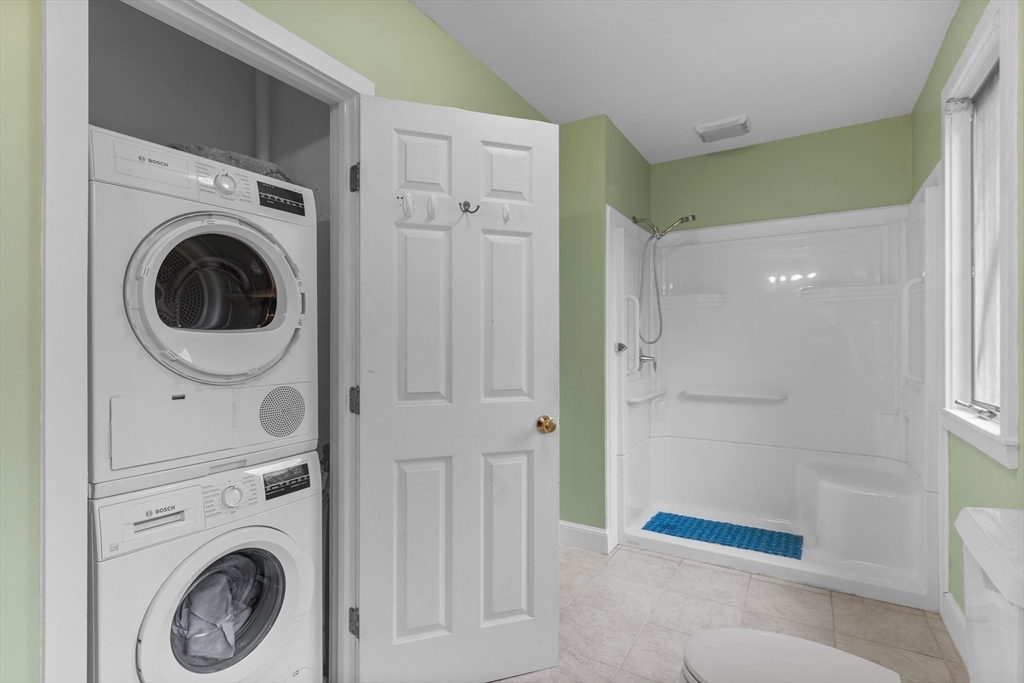 376 Pleasant Bay Road Harwich, MA 02645 - Photo 9 of 17 a view of a hallway with washer and dryer