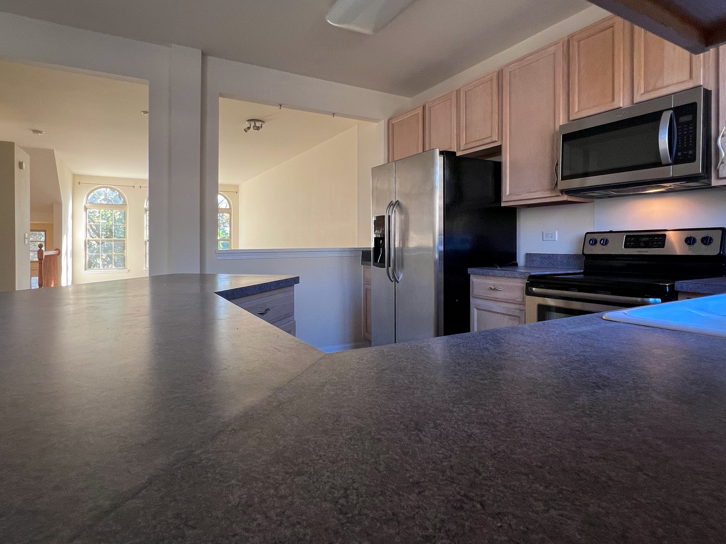 554 Prestwick Lane, Unit 554 Wheeling, IL 60090 - Photo 11 of 30 a kitchen with stainless steel appliances a stove and a refrigerator