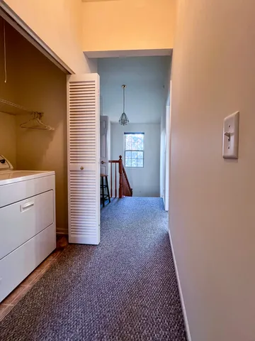 a bathroom with a double vanity sink toilet and shower