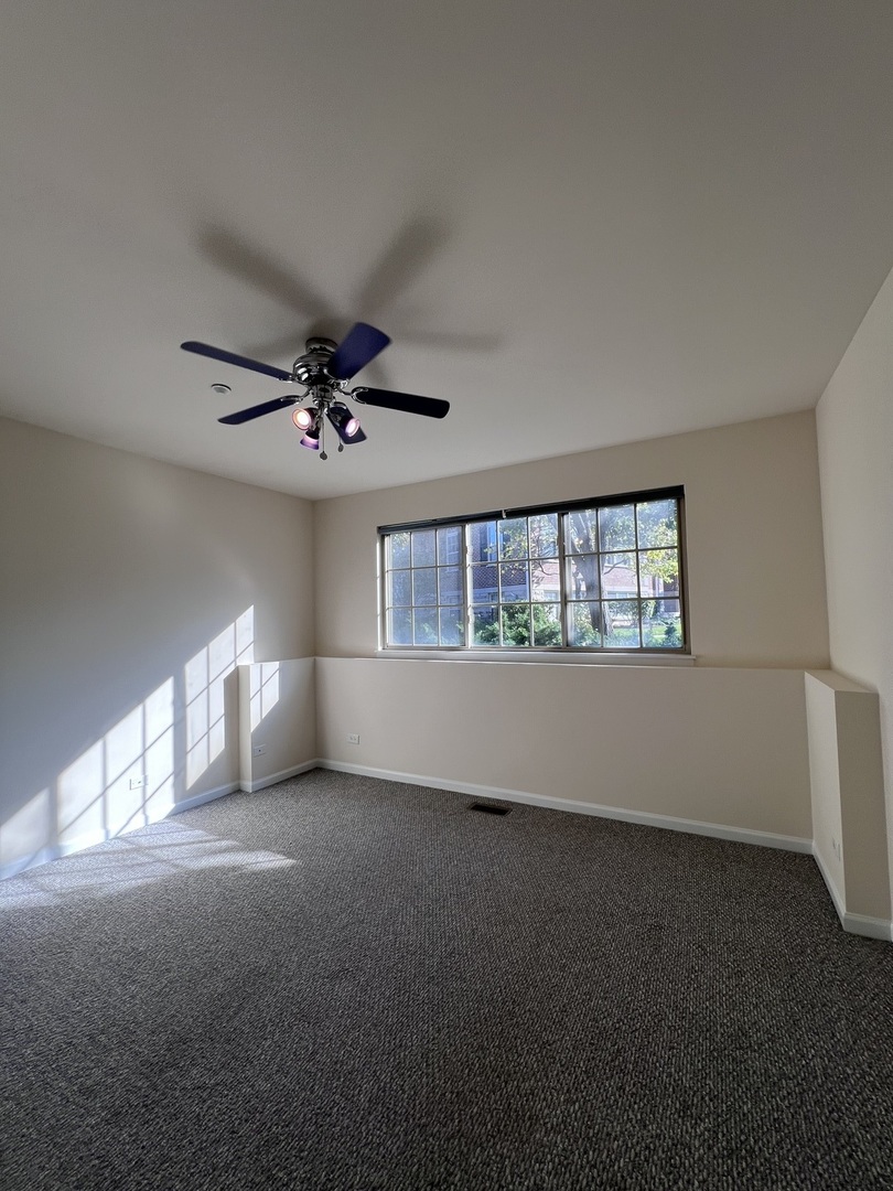 554 Prestwick Lane, Unit 554 Wheeling, IL 60090 - Photo 23 of 30 a view of an empty room with a window