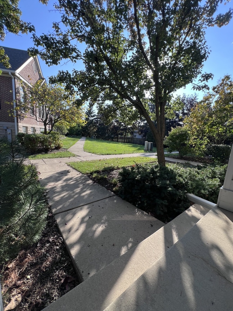 554 Prestwick Lane, Unit 554 Wheeling, IL 60090 - Photo 3 of 30 a view of an outdoor space with garden