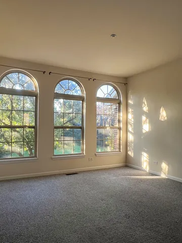 a view of an empty room with a large window