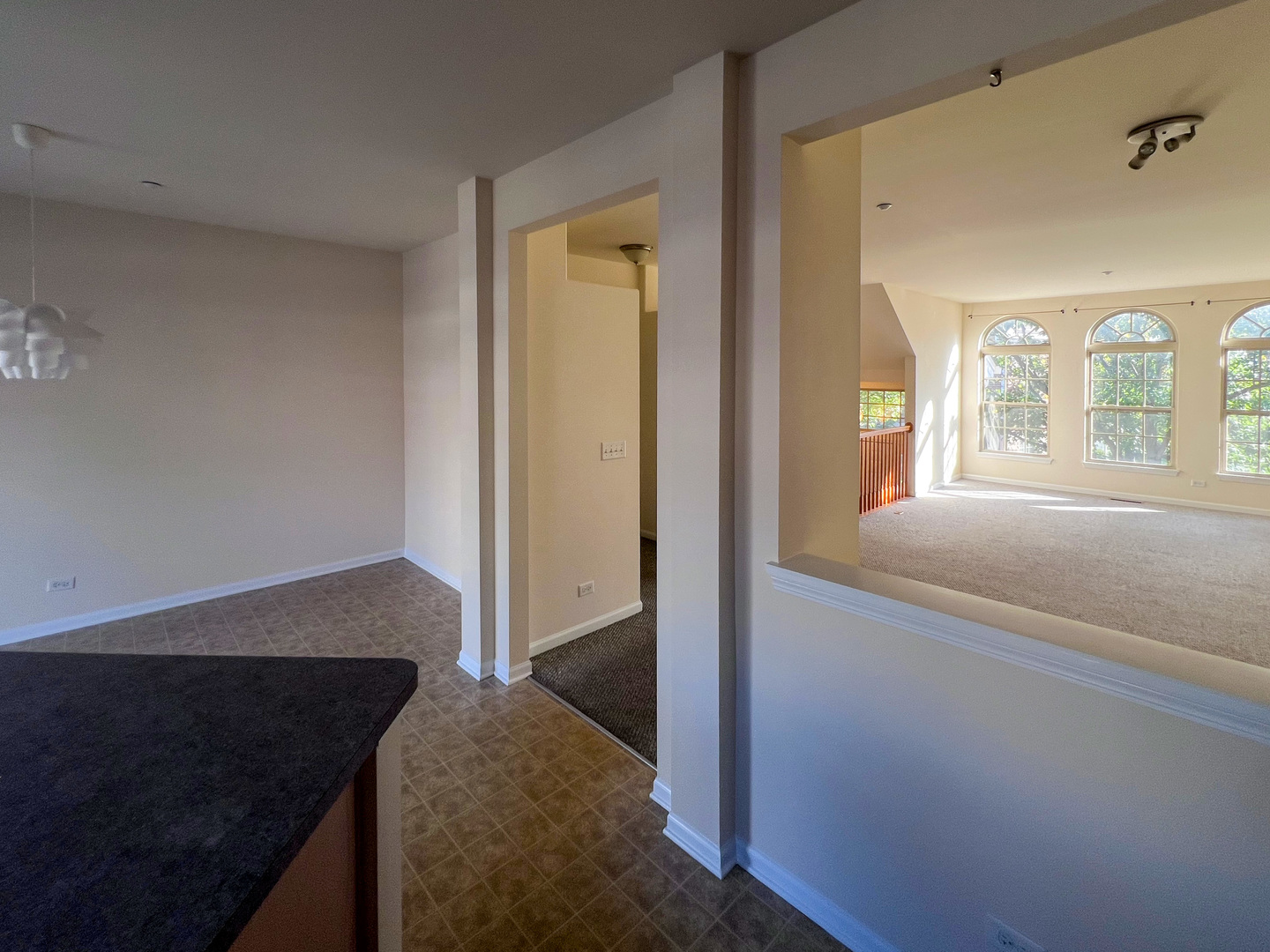 554 Prestwick Lane, Unit 554 Wheeling, IL 60090 - Photo 10 of 30 a view of entryway and bedroom with wooden floor