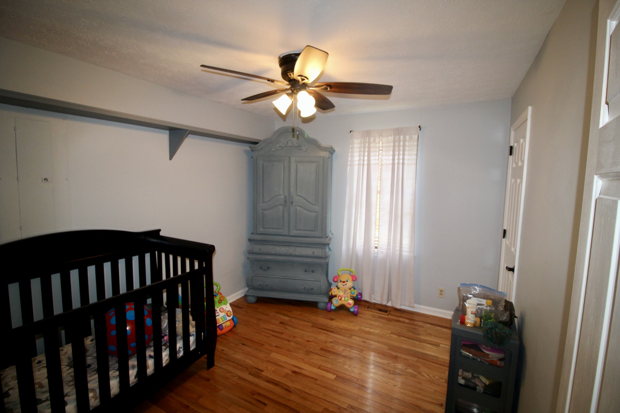 1096 Cedar Grove Road Lebanon, TN 37087 - Photo 14 of 21 a bedroom with a bed and wooden floor