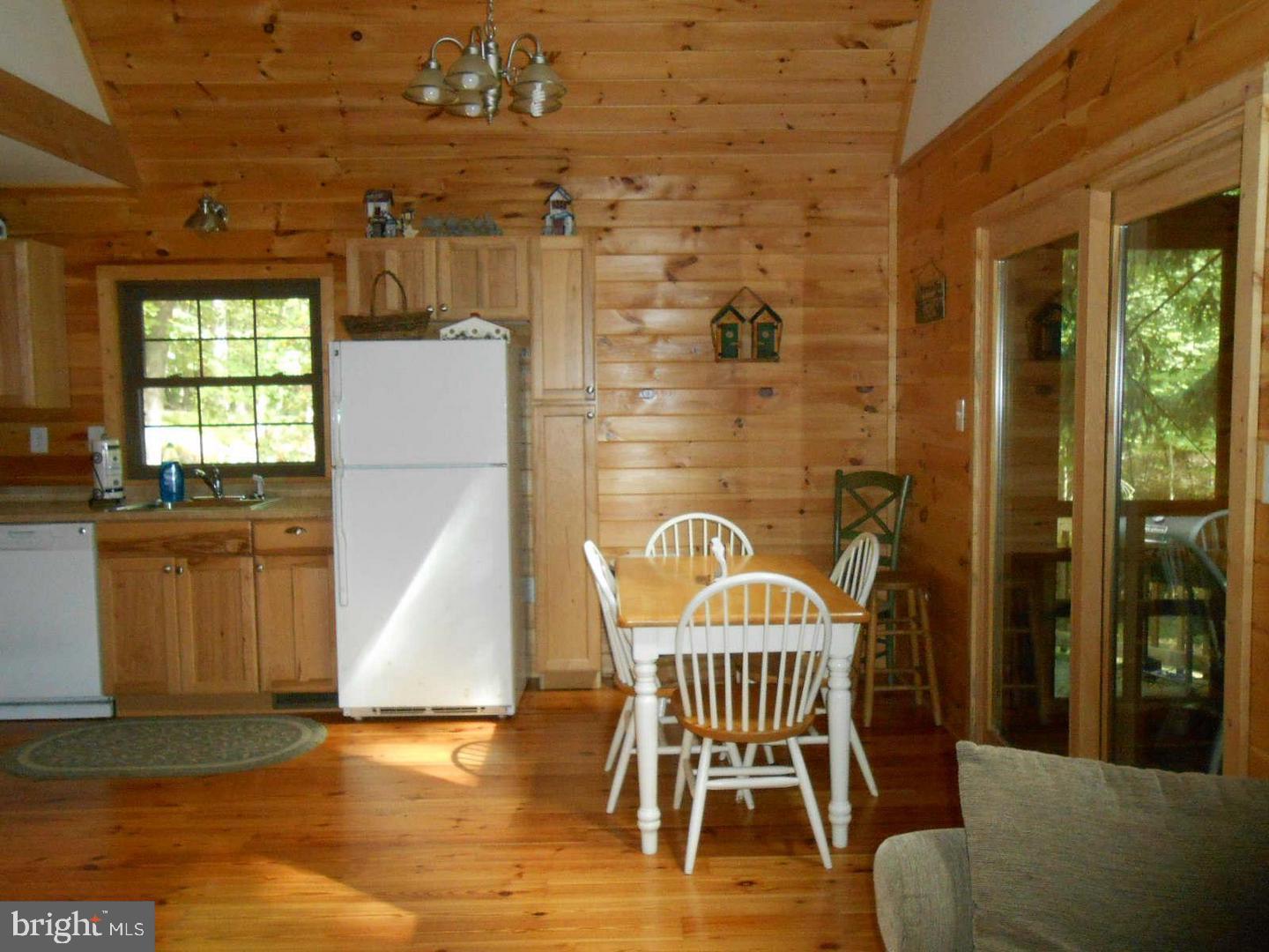 1280 Mountainside Road Berkeley Springs, WV 25411 - Photo 13 of 21 Dining area w/view of screen porch