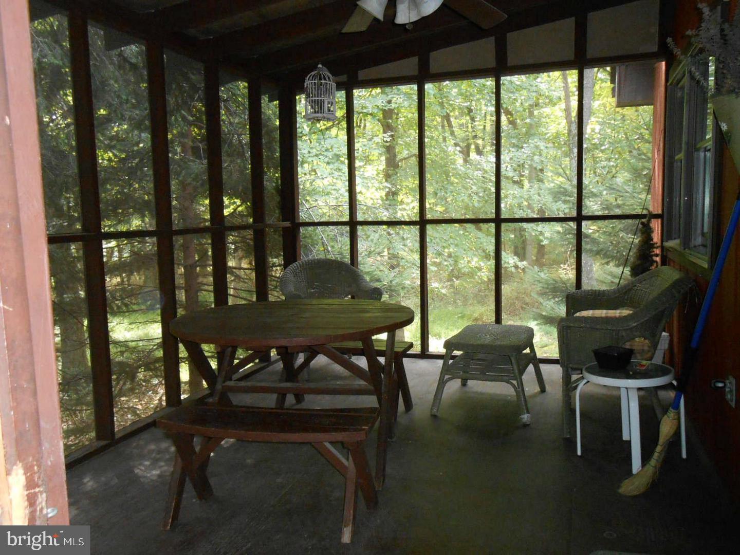 1280 Mountainside Road Berkeley Springs, WV 25411 - Photo 20 of 21 Inviting screened porch nestled in the trees