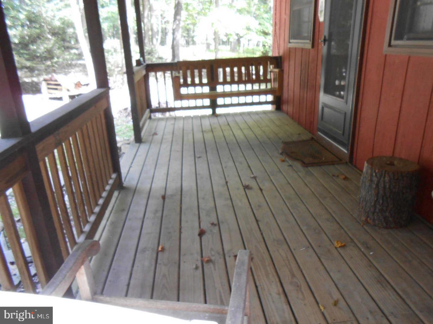 1280 Mountainside Road Berkeley Springs, WV 25411 - Photo 21 of 21 Large covered entrance porch with swing