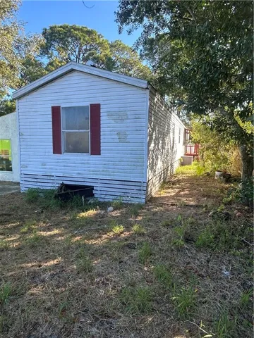 a brick building with a small yard