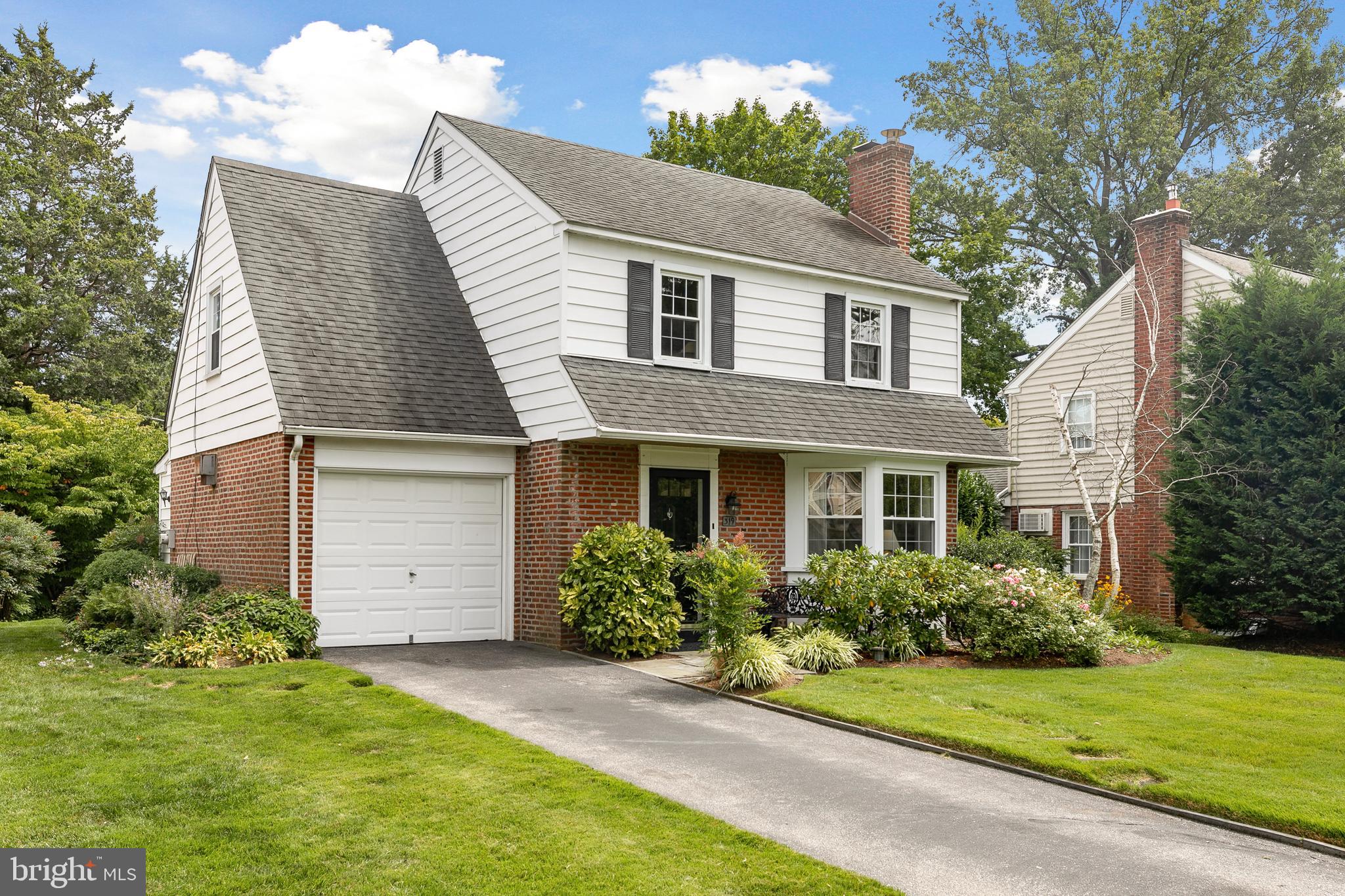 319 Canterbury Road Havertown, PA 19083 - Photo 1 of 33 a front view of a house with a garden and plants