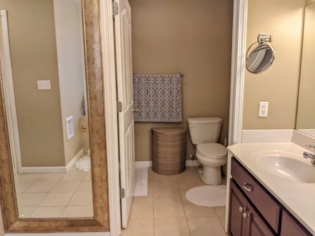 a bathroom with a toilet sink and shower