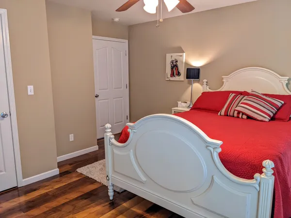 a living room with a bed and a chandelier