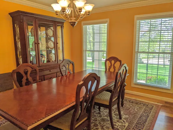a dining room with furniture and window