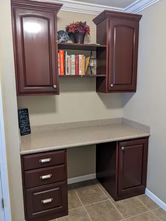 a bathroom with a sink a toilet and a window