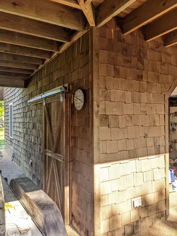 a front view of a building with a yard and garage