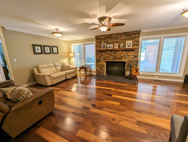 a living room with furniture and a fireplace