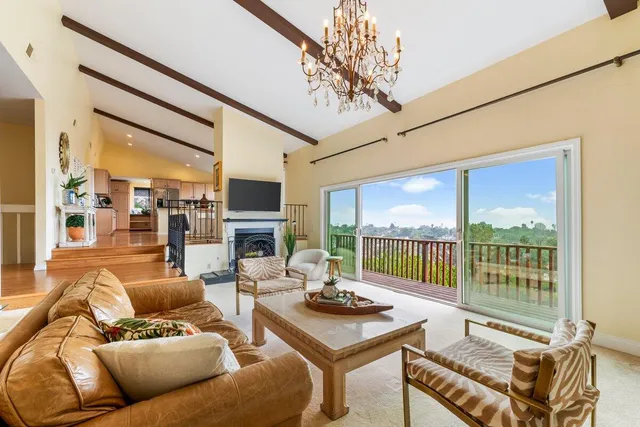 a living room with furniture fireplace and a flat screen tv