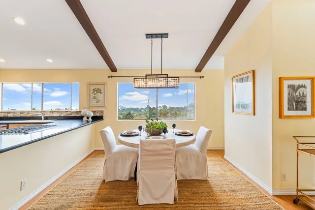 a kitchen with stainless steel appliances granite countertop a refrigerator a stove and a sink