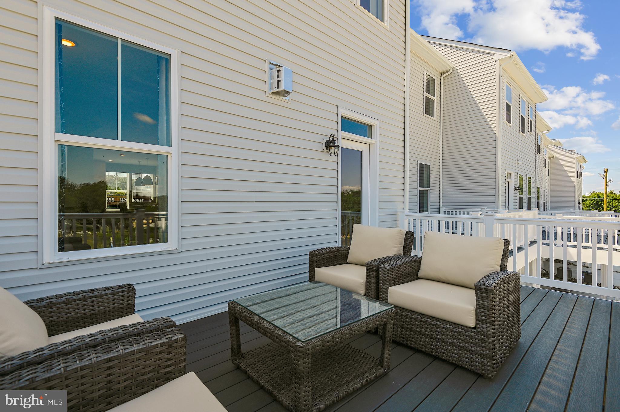 16605 Breezeway Alley Accokeek, MD 20607 - Photo 16 of 34 a view of a two chairs in the balcony