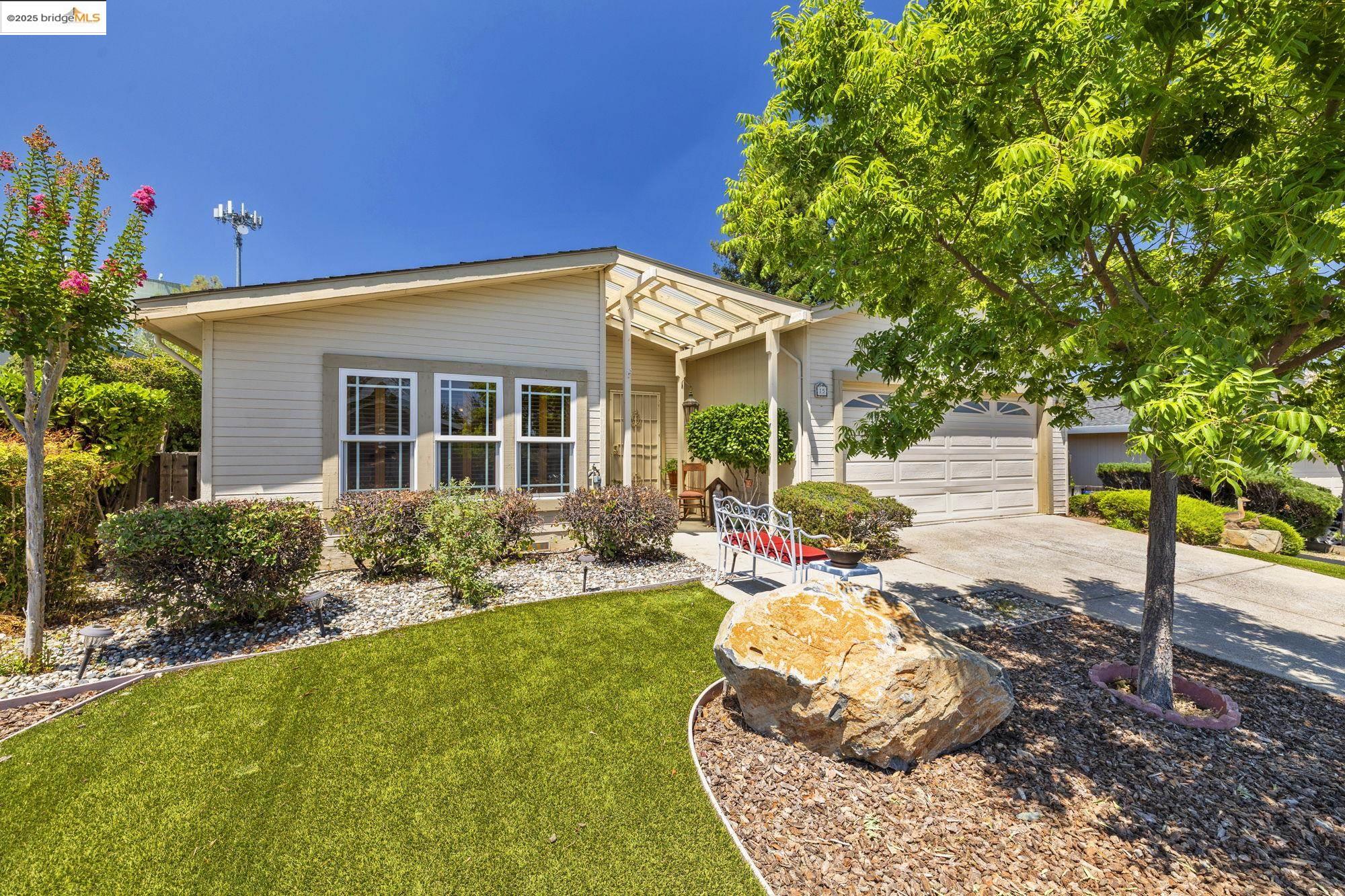 12700 Red Maple Circle, Unit SPC 15 Sonora, CA 95370 - Photo 1 of 1 View of front of property with driveway, a garage, and a front lawn