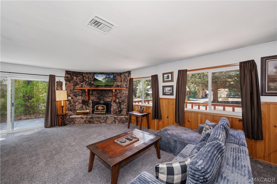 1099 Canyon Road Fawnskin, CA 92333 - Photo 9 of 39 a living room with furniture and a large window
