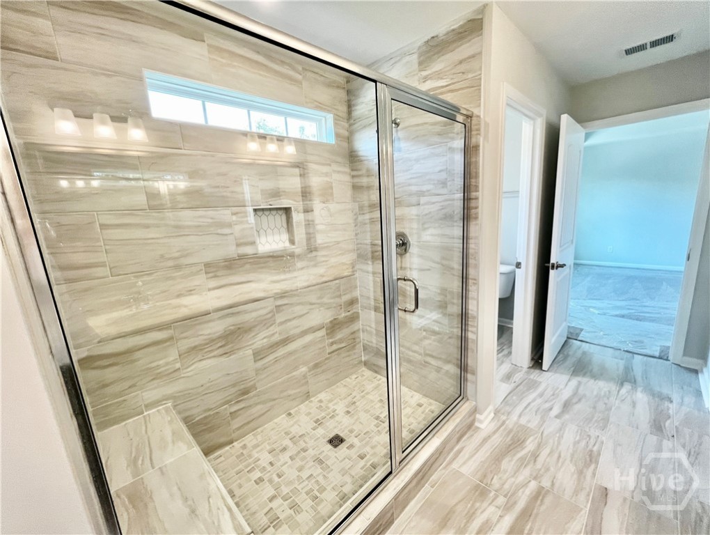 148 Como Drive Pooler, GA 31322 - Photo 27 of 41 Primary bathroom. Gorgeous 6' tiled shower-only with a bench!