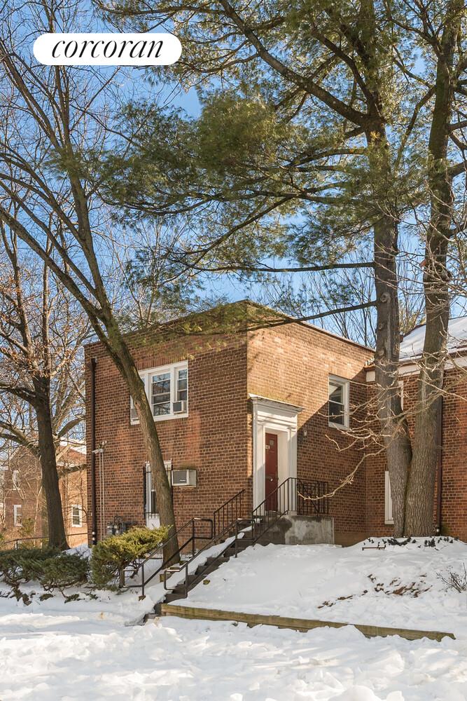 147-36 Charter Road, Unit 34E Queens, NY 11435 - Photo 10 of 14 a street sign on a road next to a building