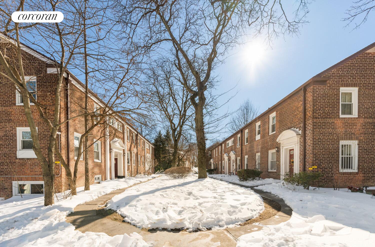 147-36 Charter Road, Unit 34E Queens, NY 11435 - Photo 11 of 14 a view of a house with snow on the road