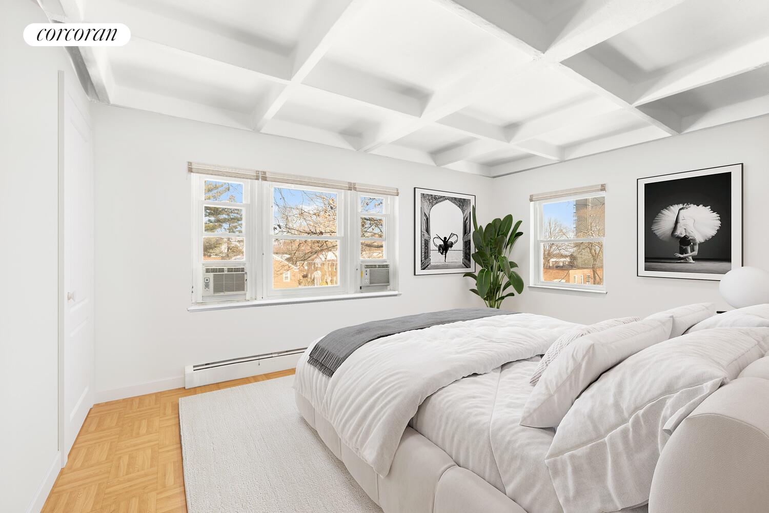 147-36 Charter Road, Unit 34E Queens, NY 11435 - Photo 13 of 14 a bedroom with a large bed and a window