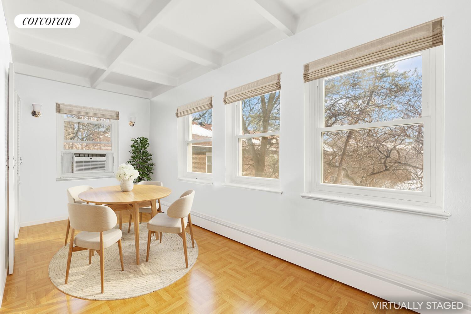 147-36 Charter Road, Unit 34E Queens, NY 11435 - Photo 3 of 14 a dining room with furniture and window