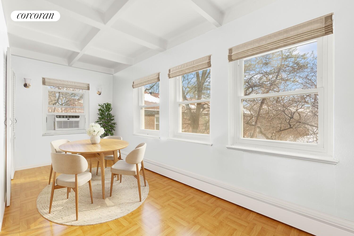 147-36 Charter Road, Unit 34E Queens, NY 11435 - Photo 5 of 14 a dining room with furniture and window