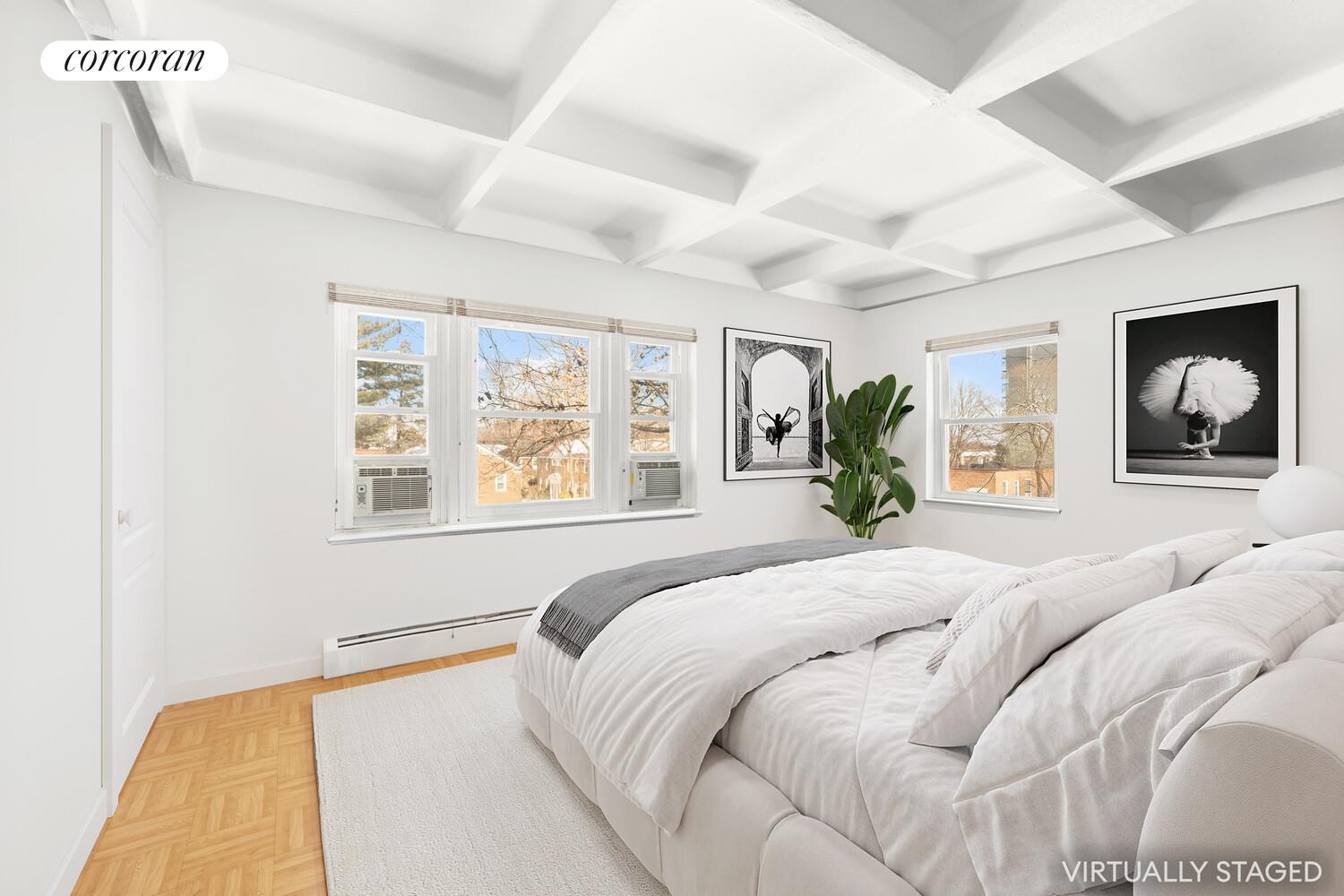 147-36 Charter Road, Unit 34E Queens, NY 11435 - Photo 7 of 14 a bedroom with a large bed and a window