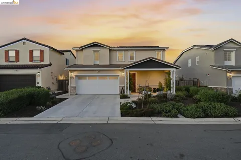 a hallway with wooden floor closet and livingroom view