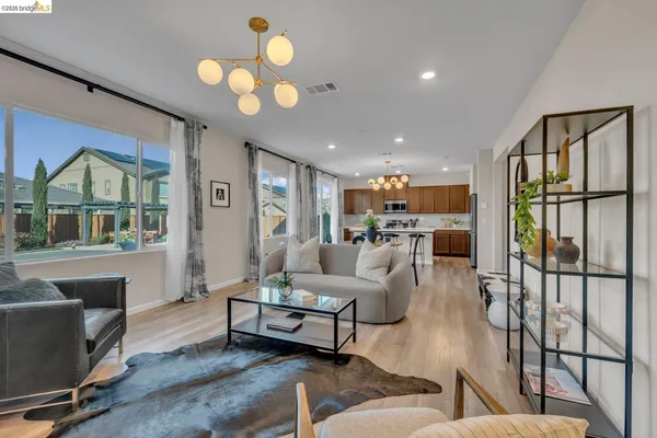 a view of a house with a yard and sitting area