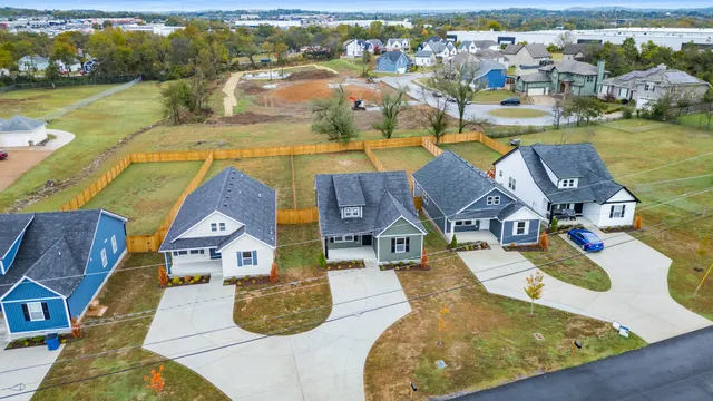 an aerial view of a house with a swimming pool view
