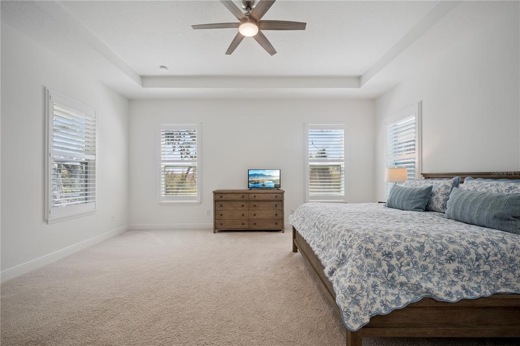 17588 Lake Star Road Winter Garden, FL 34787 - Photo 19 of 57 a bedroom with a bed and a couch